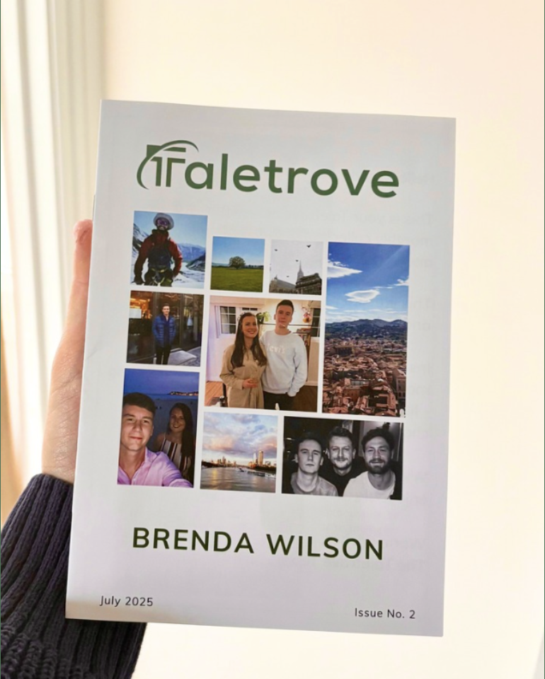 Hand holding a Taletrove newsletter